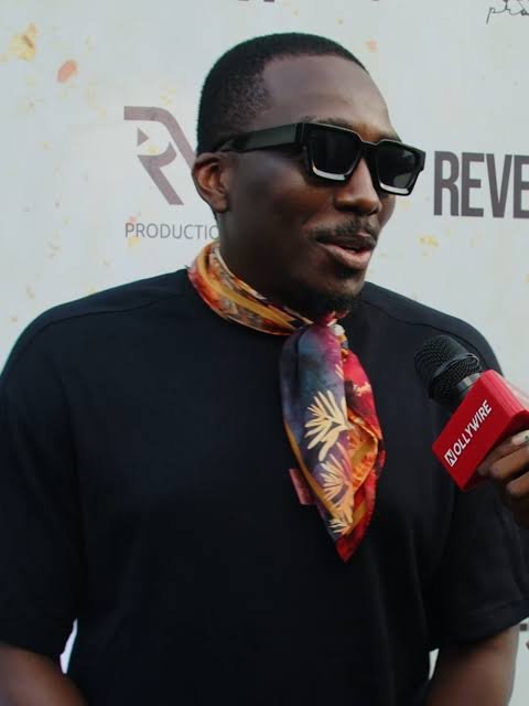 Bovi Ugboma comedy performance on stage during a stand-up tour in Lagos