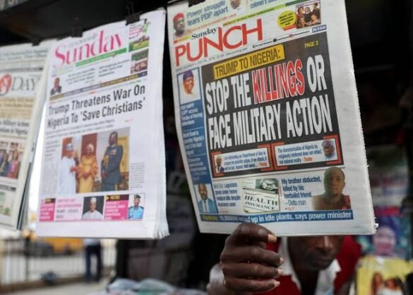 Top 10 newspapers in Nigeria displayed at a busy newspaper stand in Lagos