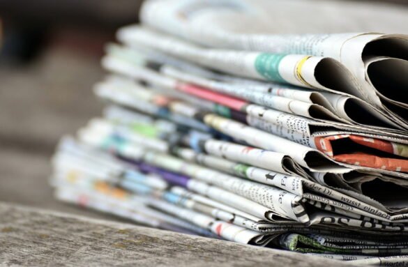 List of newspapers in Nigeria displayed on a newsstand in 2026