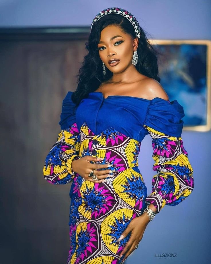 Female Nigerian comedian speaking at branded event with microphone, highlighting richest female comedians in Nigeria net worth