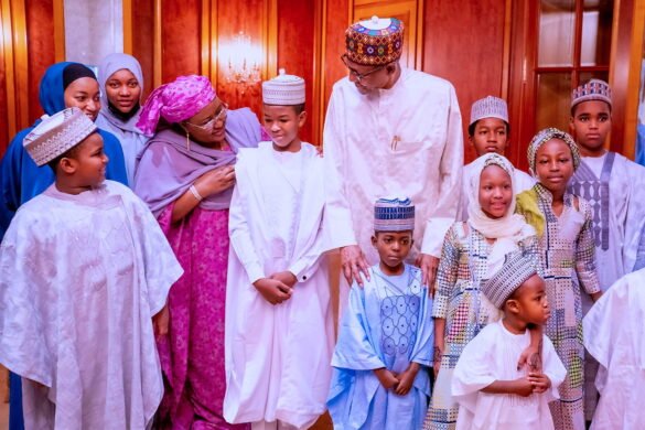 Former President Muhammadu Buhari with some of his daughters at a public event